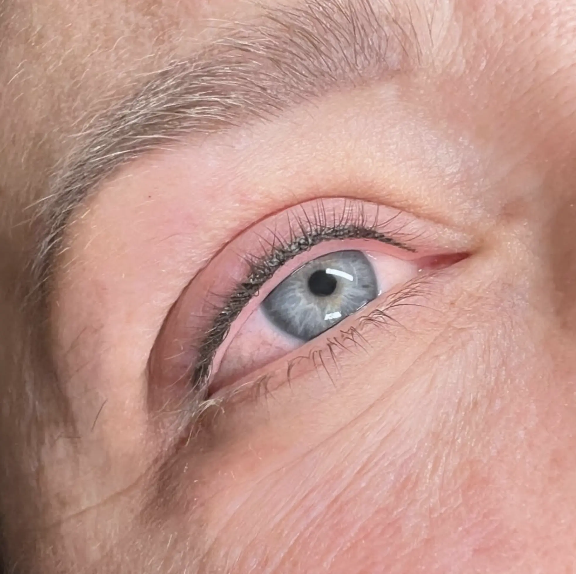 Before and after winged eyeliner tattoo